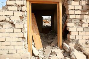 A door is open in a building that is being demolished photo