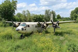 A plane that is sitting in a field photo