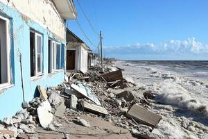 A house is destroyed by the ocean in the aftermath of hurricane sandy photo