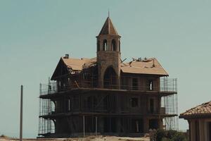 A house that is being built is being torn down photo
