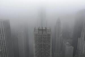 A tall building in the fog photo