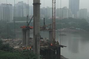 A construction site with a crane and a building photo