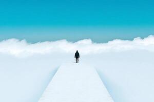 A man standing on a path in the middle of a cloud covered sky photo