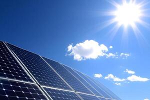 Solar panels on a blue sky with clouds photo