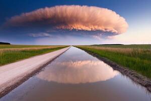 A large cloud is reflected in a puddle photo