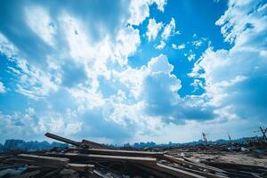 A pile of wood and debris under a blue sky photo