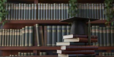 Graduation cap on stack of books in front of library photo