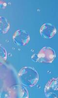 Soap bubbles on blue background photo