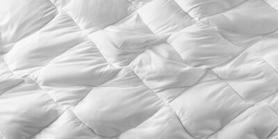 Luxury white bedding spread across a neatly made bed in a cozy interior setting during daylight hours photo