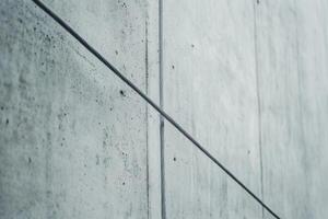 Cable against textured concrete wall in modern architectural setting photo