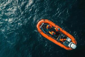 Aerial view of offshore wind turbine maintenance platform with crew in safety gear navigating their boat in the open water photo