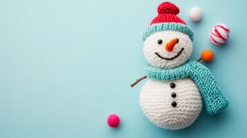 A child's handmade winter snowman craft featuring colorful details on a light blue background for festive creativity photo