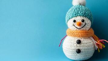 Festive handmade snowman craft created by a child with colorful details on a light blue background photo
