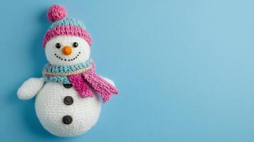 A child's colorful handmade snowman craft displayed on a light blue background showcasing winter creativity and festive spirit photo