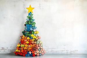 A colorful jigsaw puzzle tree adorned with a star stands cheerfully in front of a white wall, creating a festive atmosphere photo