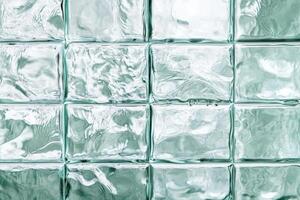 Frosted glass blocks create a textured background showcasing light reflections in a contemporary space photo