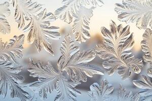 Frosted glass texture with intricate leaf patterns reflecting morning light and a soft background of winter scenery photo