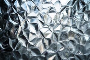 Frosted glass texture featuring diamond-like patterns reflecting light, creating a unique visual effect and depth in the design photo