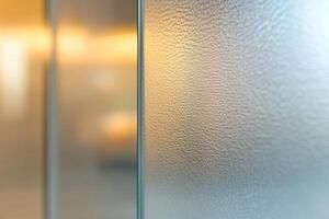 Frosted glass texture with a warm glow in the background creating a serene atmosphere for interior spaces photo