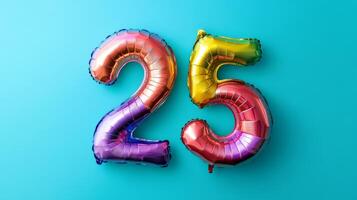 Vibrant rainbow foil balloon number twenty-five on a bright blue background for a festive celebration event photo