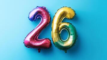 Colorful rainbow foil balloon number twenty-six on a vibrant blue background for celebrations or birthday parties photo