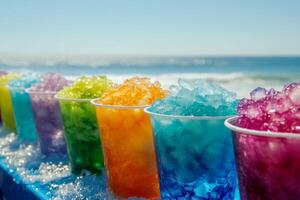 Colorful cups of shaved ice lined up on a beach table, with a blue cup among them, brightening the sunny seaside view photo