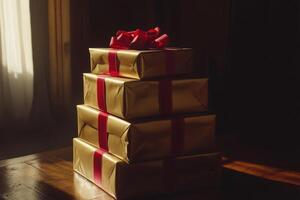 A stack of luxurious golden gift boxes with red ribbons wrapped elegantly for festive celebrations in a cozy setting photo