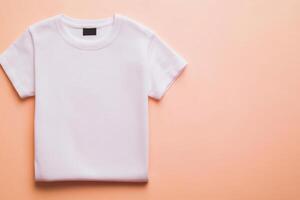 Minimalist composition featuring a folded white t-shirt on a plain background with studio lighting for mockup purposes photo