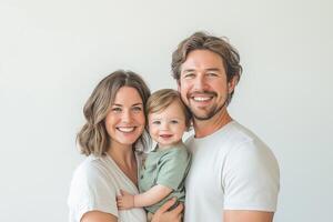Happy family of three smiling together against a minimalistic white background in a bright and cheerful setting photo