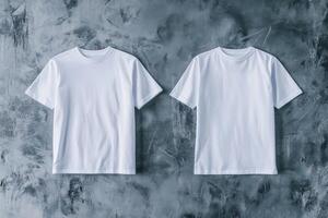 Minimalist display of a white t-shirt on a gray backdrop with front and back views illuminated by studio lighting in a modern setting photo