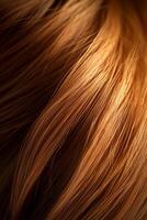 Close-up of silky auburn hair strands illuminated in soft lighting, showcasing rich color and texture ideal for beauty marketing concepts photo