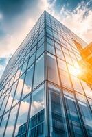 Modern high-rise glass building capturing sunlight in an urban cityscape with nearby structures reflecting a sleek design photo