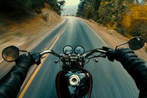 A biker enjoys the freedom of the open road while cruising down a scenic highway during a clear day photo