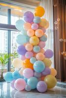 A vibrant arrangement of colorful pastel balloons perfect for celebrations and events in a modern indoor venue photo