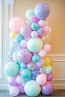 Colorful pastel balloon arrangement perfect for festive events and celebrations in a cheerful indoor setting photo