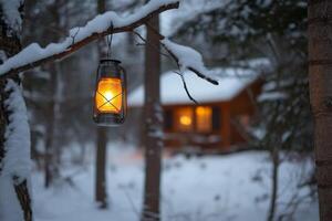 Glowing lantern illuminates winter forest with cozy cabin in the distance photo