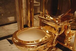 Luxurious golden toilet in a marble bathroom adds opulence and elegance to the restroom decor photo