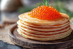 Delicious stack of pancakes topped with rich salmon roe on a rustic wooden plate for a hearty breakfast photo
