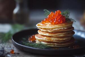 Delicious stack of pancakes topped with salmon roe garnished with fresh herbs in a cozy breakfast setting photo
