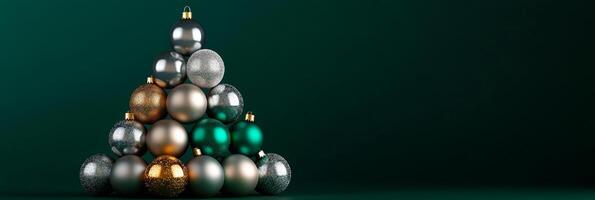 An elegant modern Christmas tree composed of silver, green, and golden baubles against an emerald green backdrop for the festive season photo