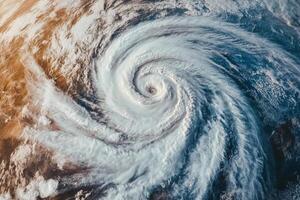 Aerial view of a powerful hurricane storm swirling over the ocean with dramatic clouds and intense weather patterns captured from space photo