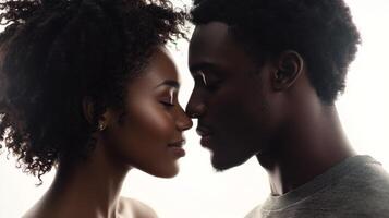 A loving black couple shares a romantic moment, gazing into each other's eyes and embracing their connection in a serene setting photo