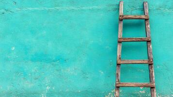 A wooden ladder leans against a freshly painted turquoise wall, enhancing the creative process of home renovation photo