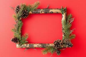 Creative Christmas frame on a vibrant red background, perfect for holiday greetings, invitations, and New Year celebrations photo