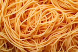 Freshly cooked spaghetti ready to be served, showcasing its golden hue and delicious texture on a clean background photo