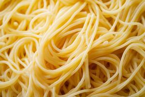 Freshly prepared spaghetti served on a plate with ample room for additional toppings in a cozy kitchen setting photo