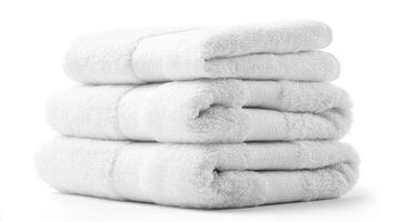Neatly folded clean white towels stacked on a white background, perfect for spa, bathroom, or home decoration photo