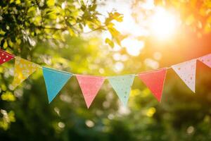 Colorful flags create a festive atmosphere at an outdoor celebration during a sunny afternoon, enhancing the joyful spirit of the event photo