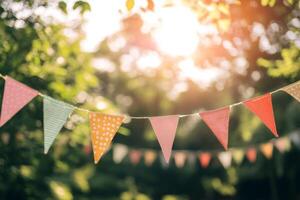 Colorful flags strung across a sunny outdoor event create a festive atmosphere for celebration in a vibrant setting photo