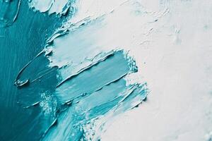 Aqua abstract brush marks create a textured pattern on a light canvas, showcasing oil paint techniques in vibrant colors photo